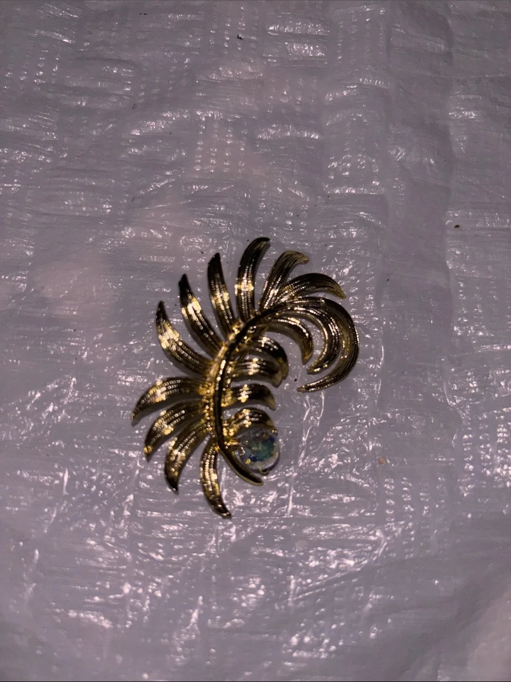 Gold Tone Floral Swirl Brooch with Iridescent Crystal